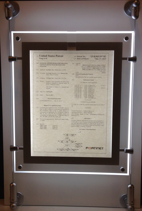 Framed United States flag code guide displayed on a wall.