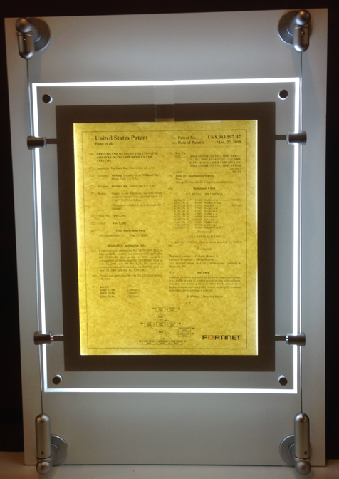 Illuminated display frame showcasing a detailed document with text and diagrams.