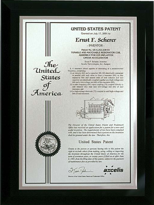 A framed United States patent for Ernest F. Schecter with detailed text and seal.